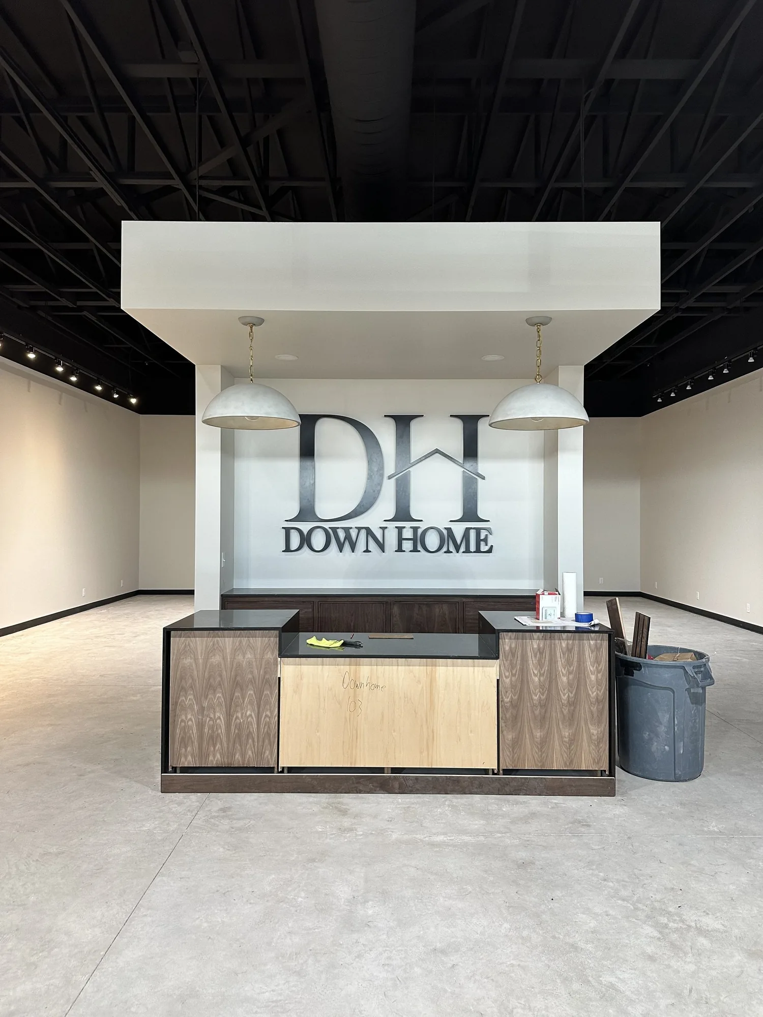 The finished reception desk at Down Home by DeBoers, a light commercial build-out by Pride Built Homes